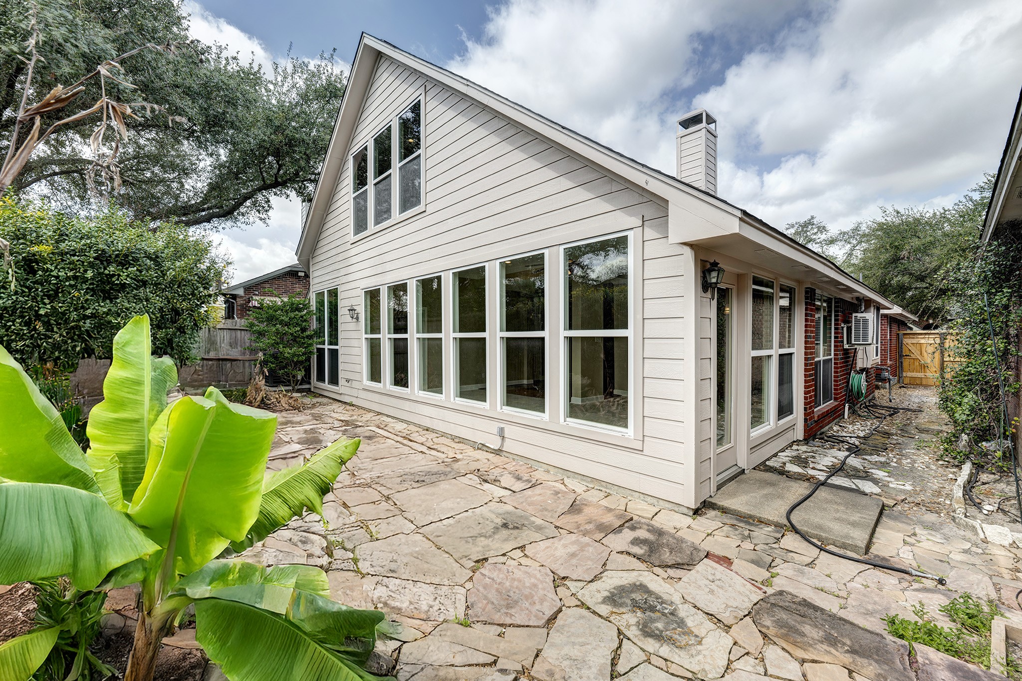 7019 Lawler Ridge Houston, TX 77055 - Photo 18 of 18 a view of a house with a yard