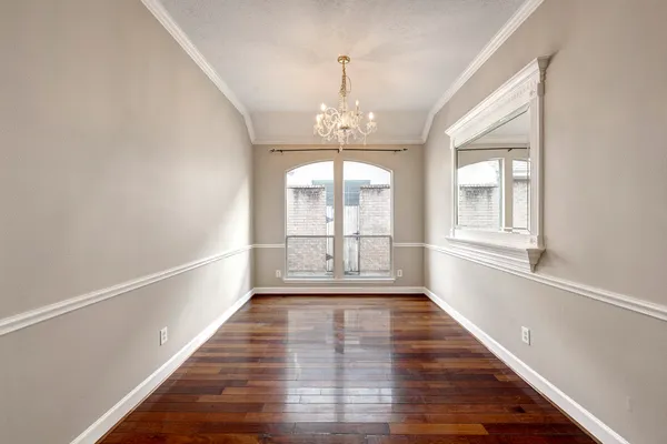 a view of an entryway with wooden floor and windows