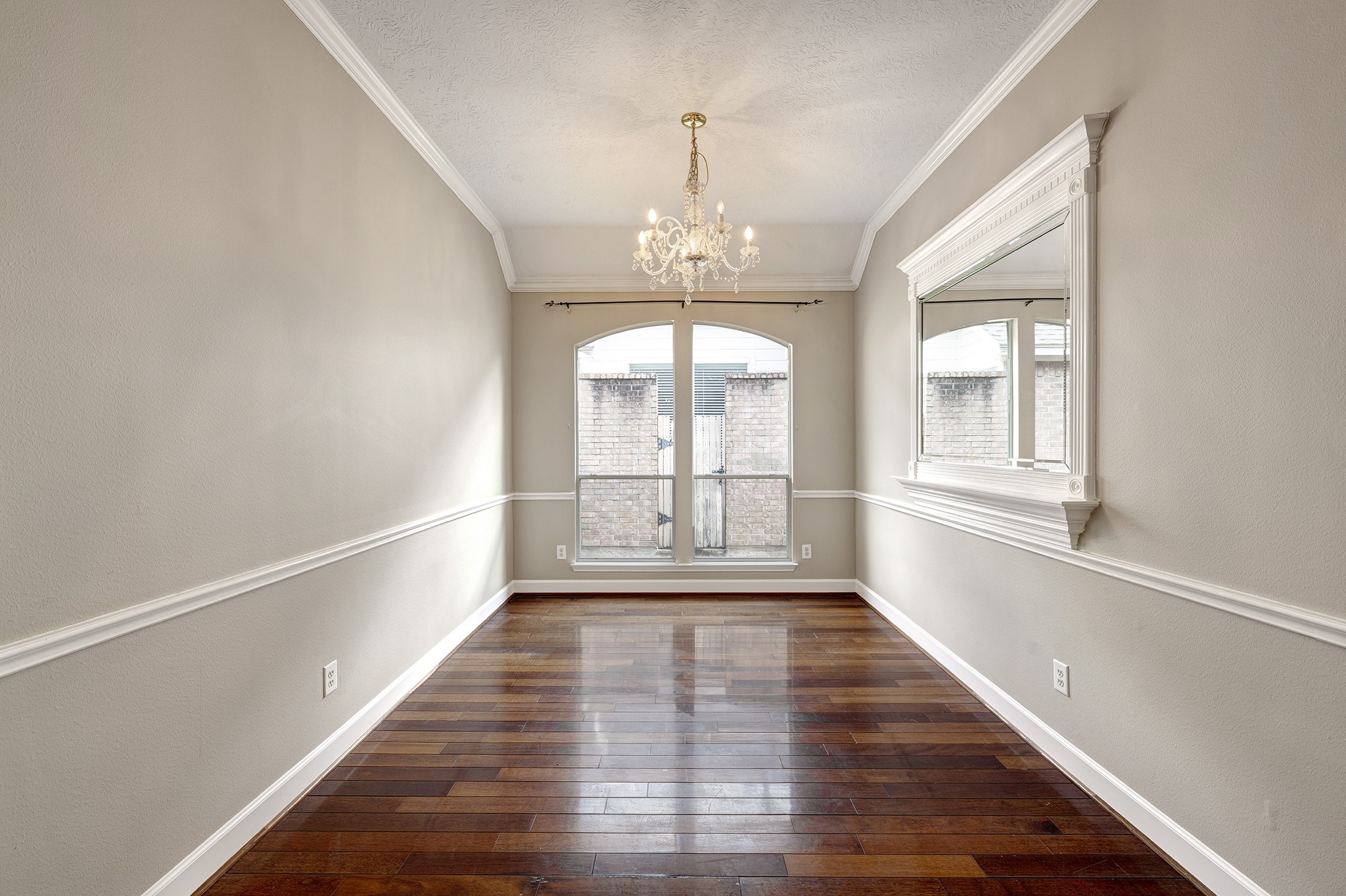 7019 Lawler Ridge Houston, TX 77055 - Photo 3 of 18 a view of an entryway with wooden floor and windows