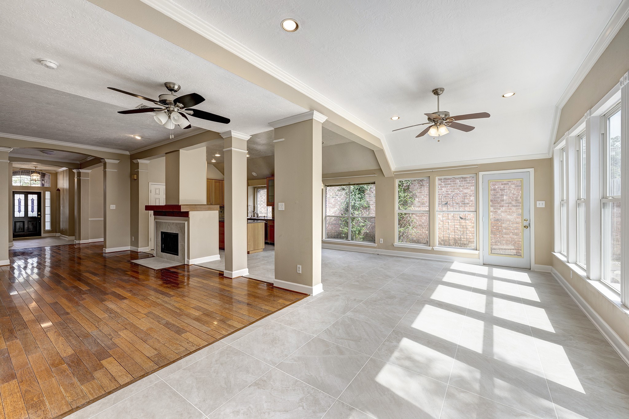 7019 Lawler Ridge Houston, TX 77055 - Photo 6 of 18 a view of an empty room with window and a kitchen view