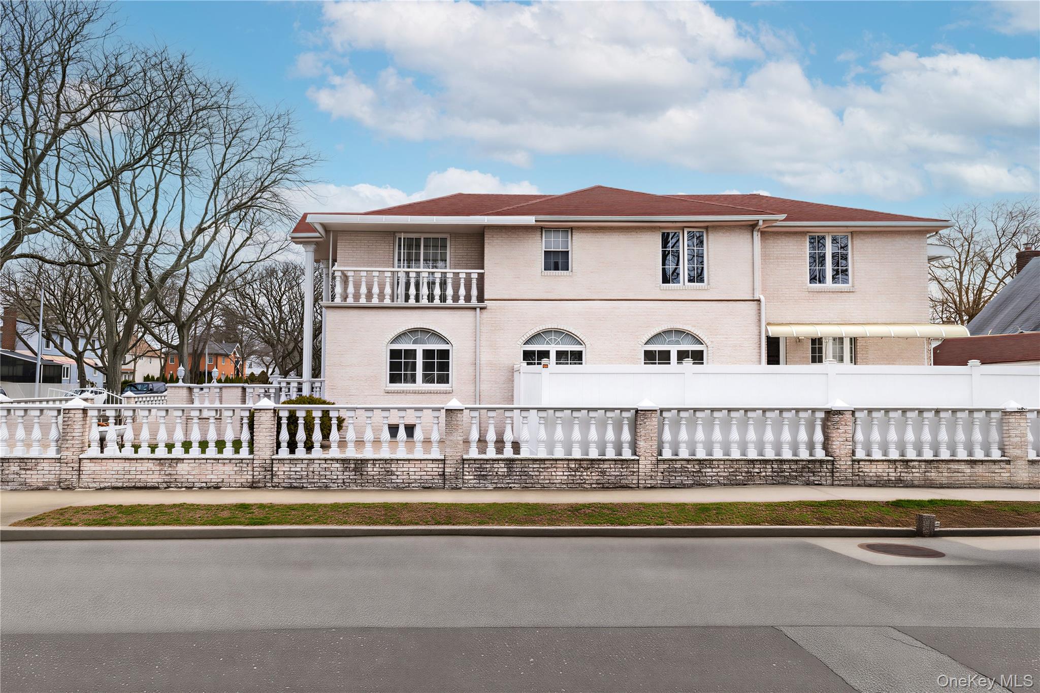 265-04 79th Avenue Queens, NY 11004 - Photo 19 of 22 a front view of a house with a swimming pool