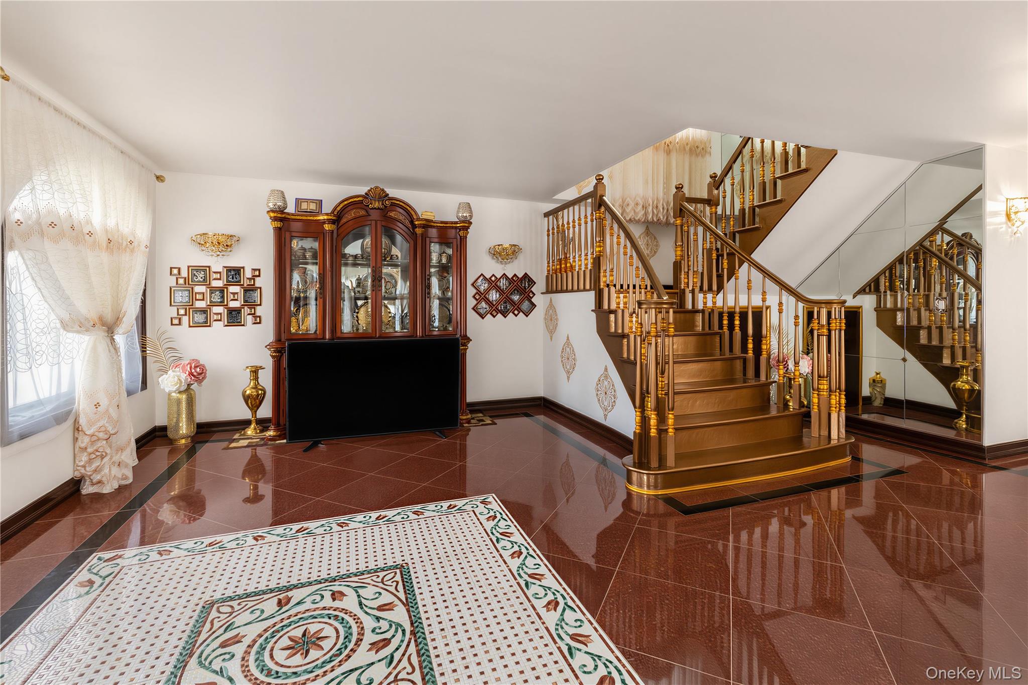 265-04 79th Avenue Queens, NY 11004 - Photo 5 of 22 a view of entryway livingroom and hall with wooden floor