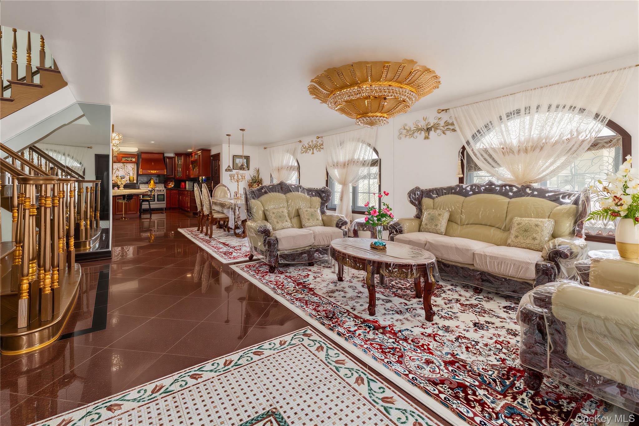 265-04 79th Avenue Queens, NY 11004 - Photo 6 of 22 a living room with lots of furniture and a rug