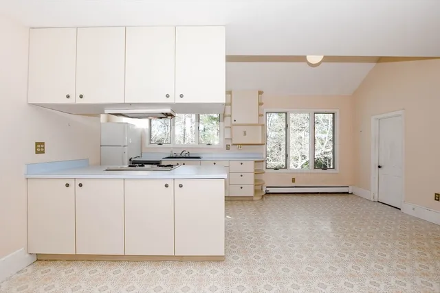 a view of a bathroom with a bathtub and a toilet