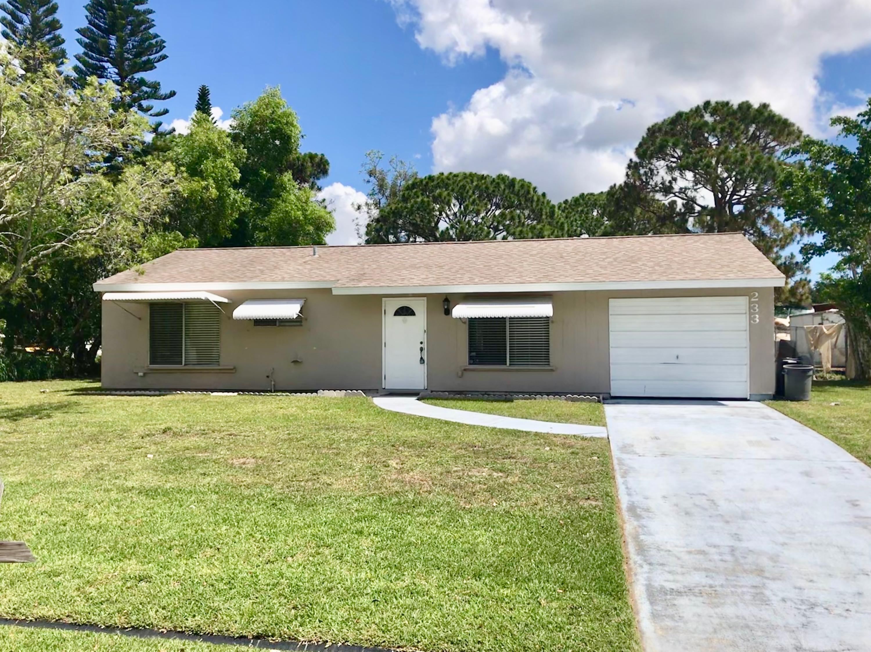 233 Southwest Cherryhill Road Port St. Lucie, FL 34953 - Photo 1 of 21 Front