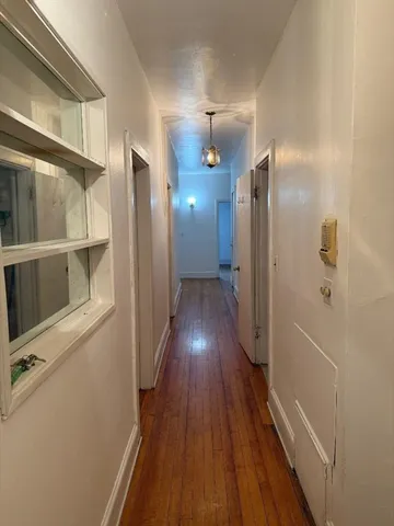 a view of gallery with wooden floor