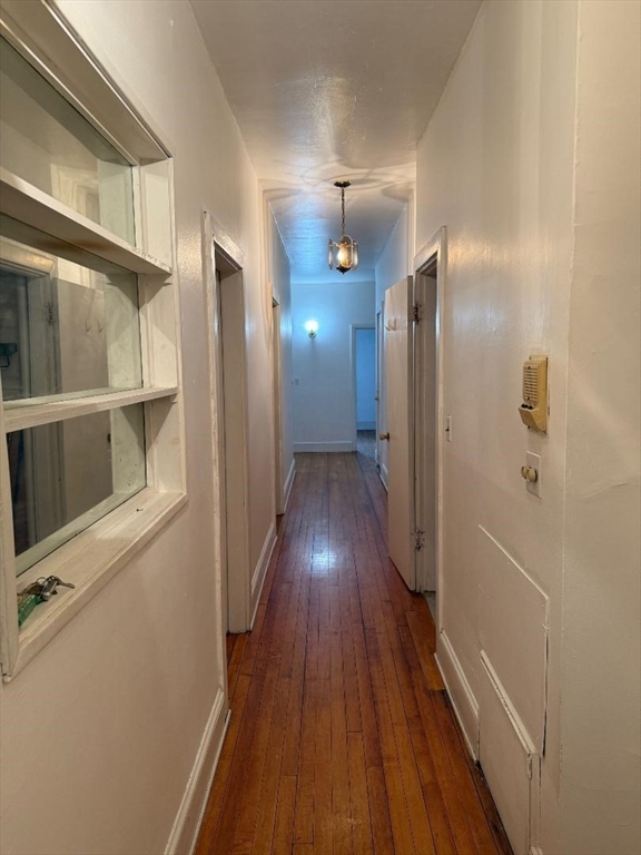 1834 Beacon Street, Unit 11 Brookline, MA 02445 - Photo 2 of 7 a view of gallery with wooden floor