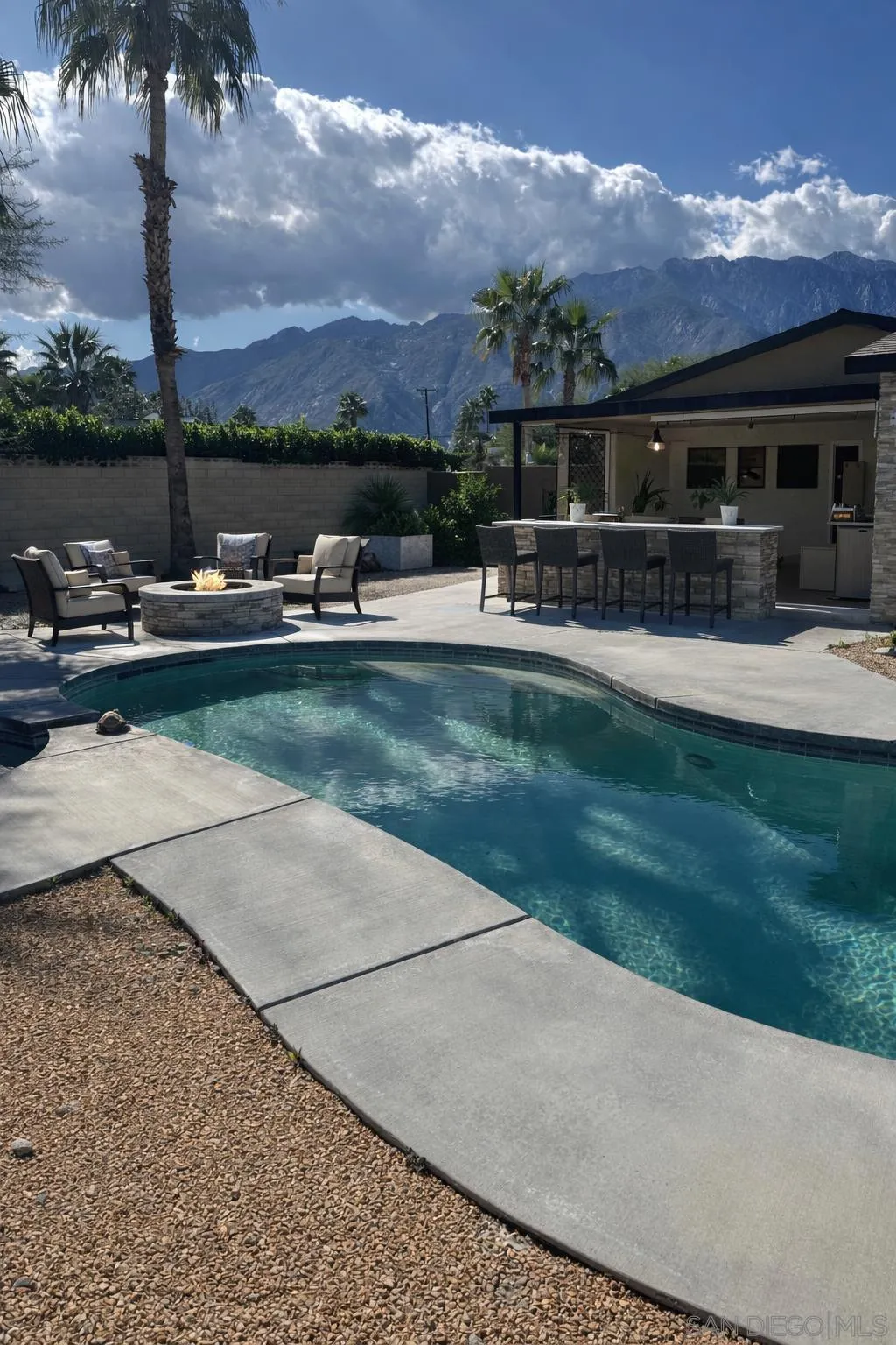 2940 North Cypress Road Palm Springs, CA 92262 - Photo 5 of 21 This photo has been digitally altered. The bar and firepit were digitally staged to show how the backyard could be. Also, the belongings of the current owner were digitally removed. The next picture shows how the home currently looks.
