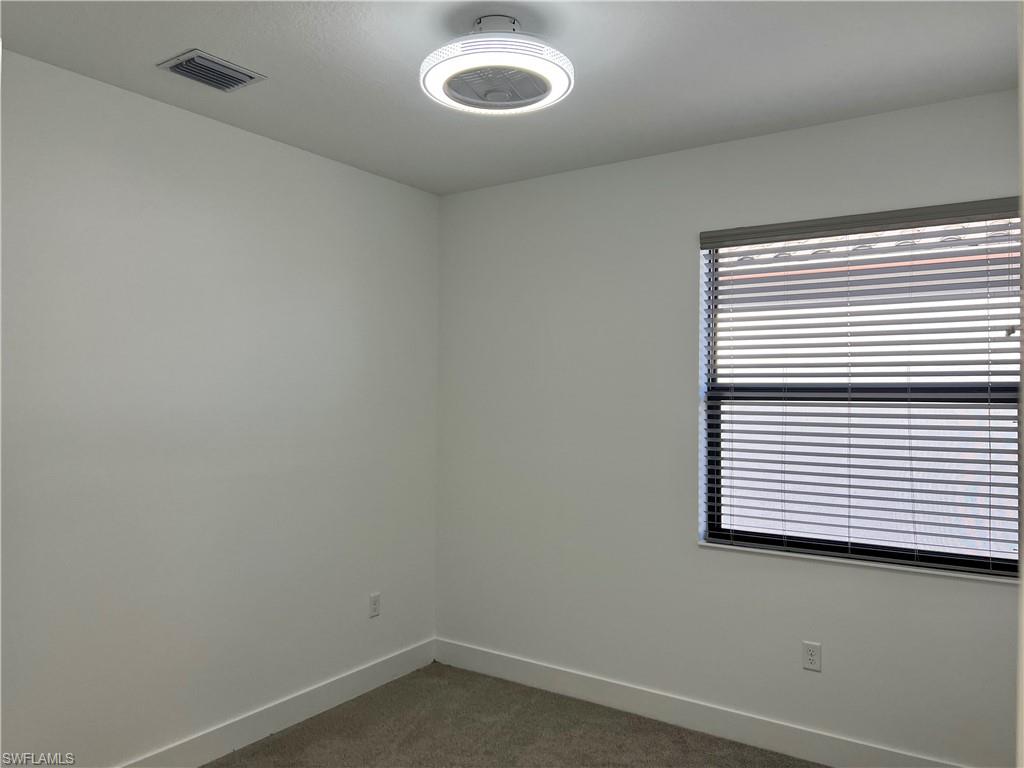 5653 Cerva Lane Ave Maria, FL 34142 - Photo 11 of 24 an empty room with a window