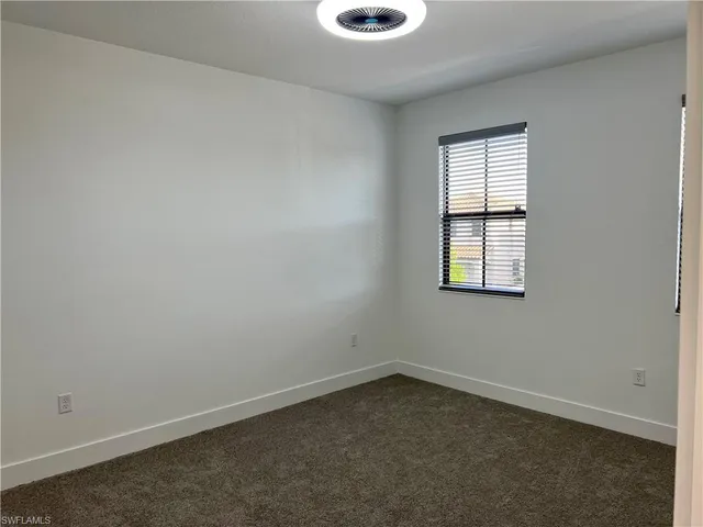 a view of a hallway with stairs