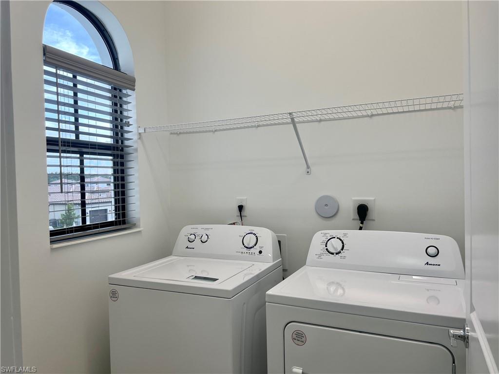 5653 Cerva Lane Ave Maria, FL 34142 - Photo 18 of 24 a utility room with dryer and washer