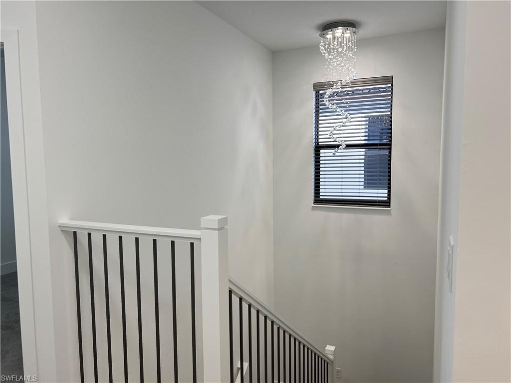 5653 Cerva Lane Ave Maria, FL 34142 - Photo 19 of 24 Stairway with chandelier
