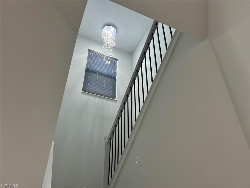 5653 Cerva Lane Ave Maria, FL 34142 - Photo 20 of 24 a view of a hallway with stairs