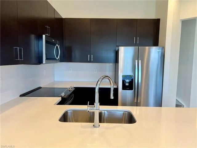 a bathroom with a sink a mirror and a bathtub