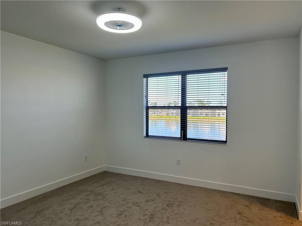5653 Cerva Lane Ave Maria, FL 34142 - Photo 10 of 24 an empty room with a window