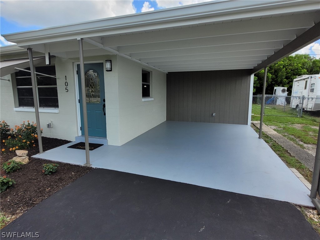 105 Alabama Road South Lehigh Acres, FL 33936 - Photo 3 of 25 a view of a porch of a house
