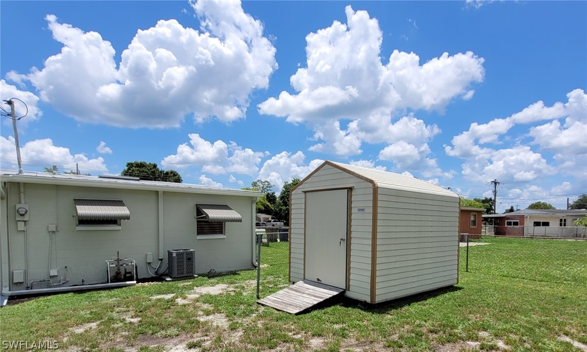 105 Alabama Road South Lehigh Acres, FL 33936 - Photo 6 of 25 a view of a house with a yard