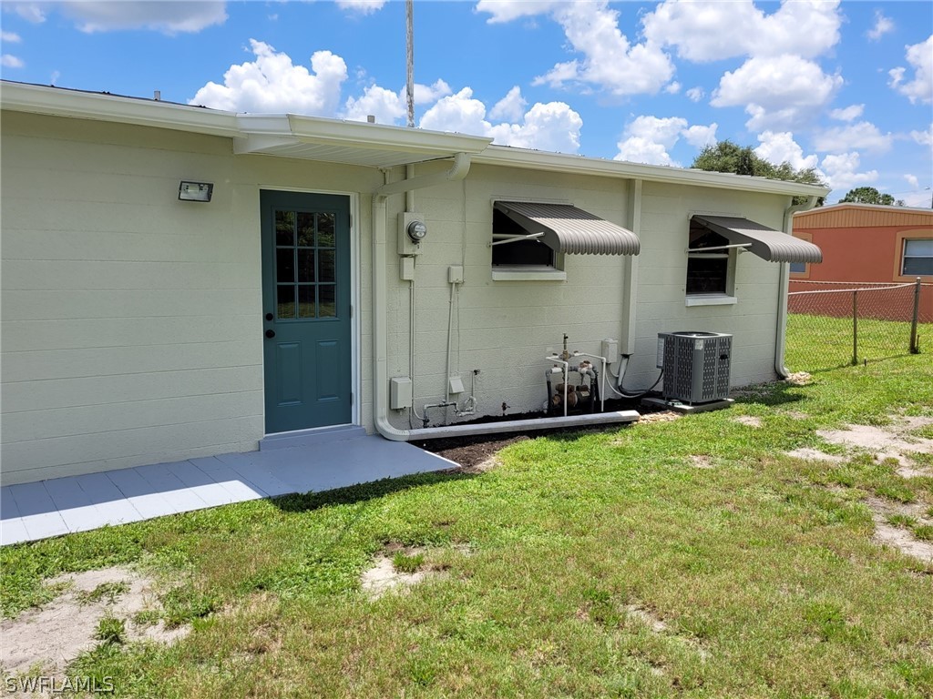 105 Alabama Road South Lehigh Acres, FL 33936 - Photo 7 of 25 a front view of house with yard