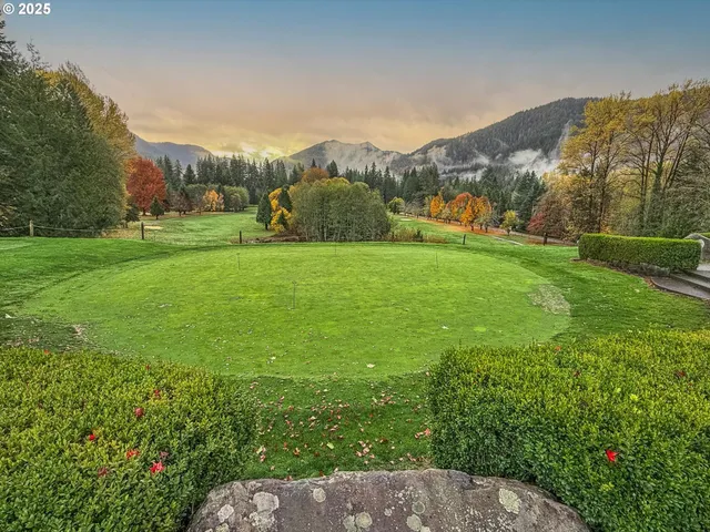 a view of a golf course with a lake