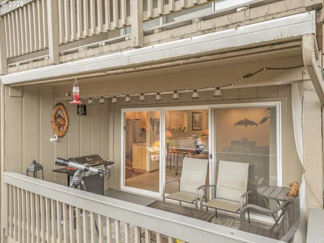 a view of a two chairs on the roof deck