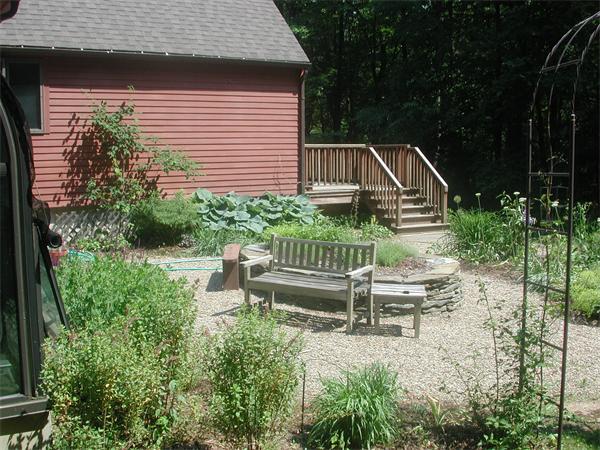21 Gulf Road Pelham, MA 01002 - Photo 6 of 30 a view of a chair and tables in the backyard of the house