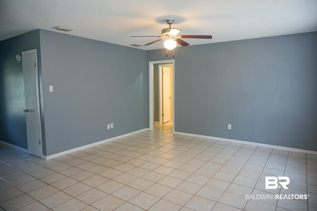 4366 Fathbrook Lane Mobile, AL 36693 - Photo 5 of 14 Empty room with ceiling fan and baseboards
