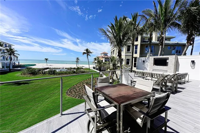 a view of a chairs and table on the patio