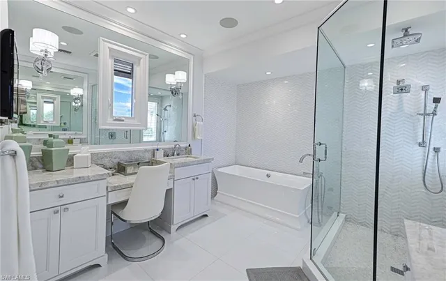 a bathroom with a double vanity sink a toilet a mirror and shower