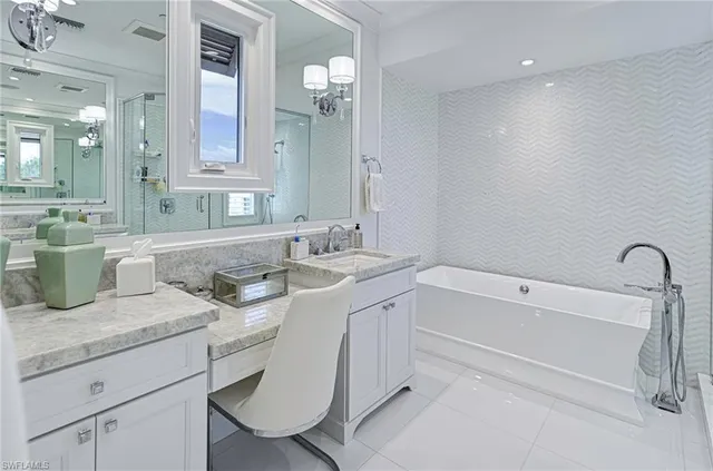 a bathroom with a sink double vanity granite tub and shower
