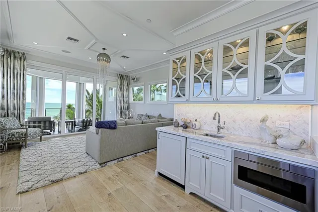 a kitchen with a sink stove and wooden cabinets