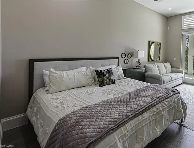 a bedroom with bed and window