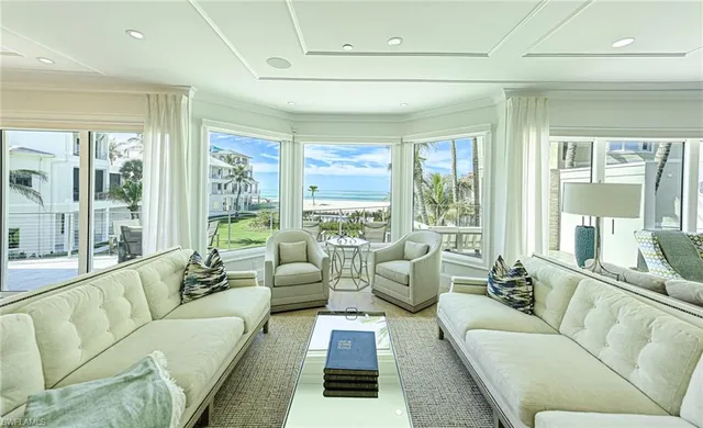 a living room with furniture and windows