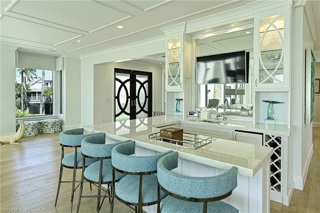 a dining room with furniture and wooden floor