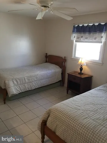 a room with a mirror and lamp