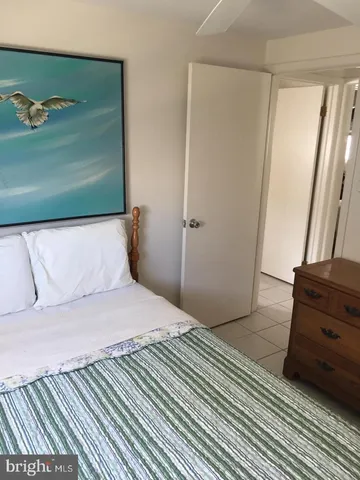 a view of hallway with a bathroom