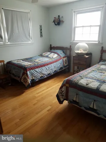a bathroom with a toilet and a shower curtain