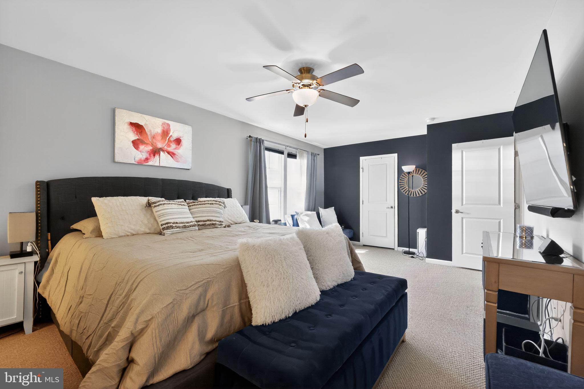 132 Redtail Hawk Circle Sewell, NJ 08080 - Photo 16 of 30 a spacious bedroom with a bed and glass walk in closet
