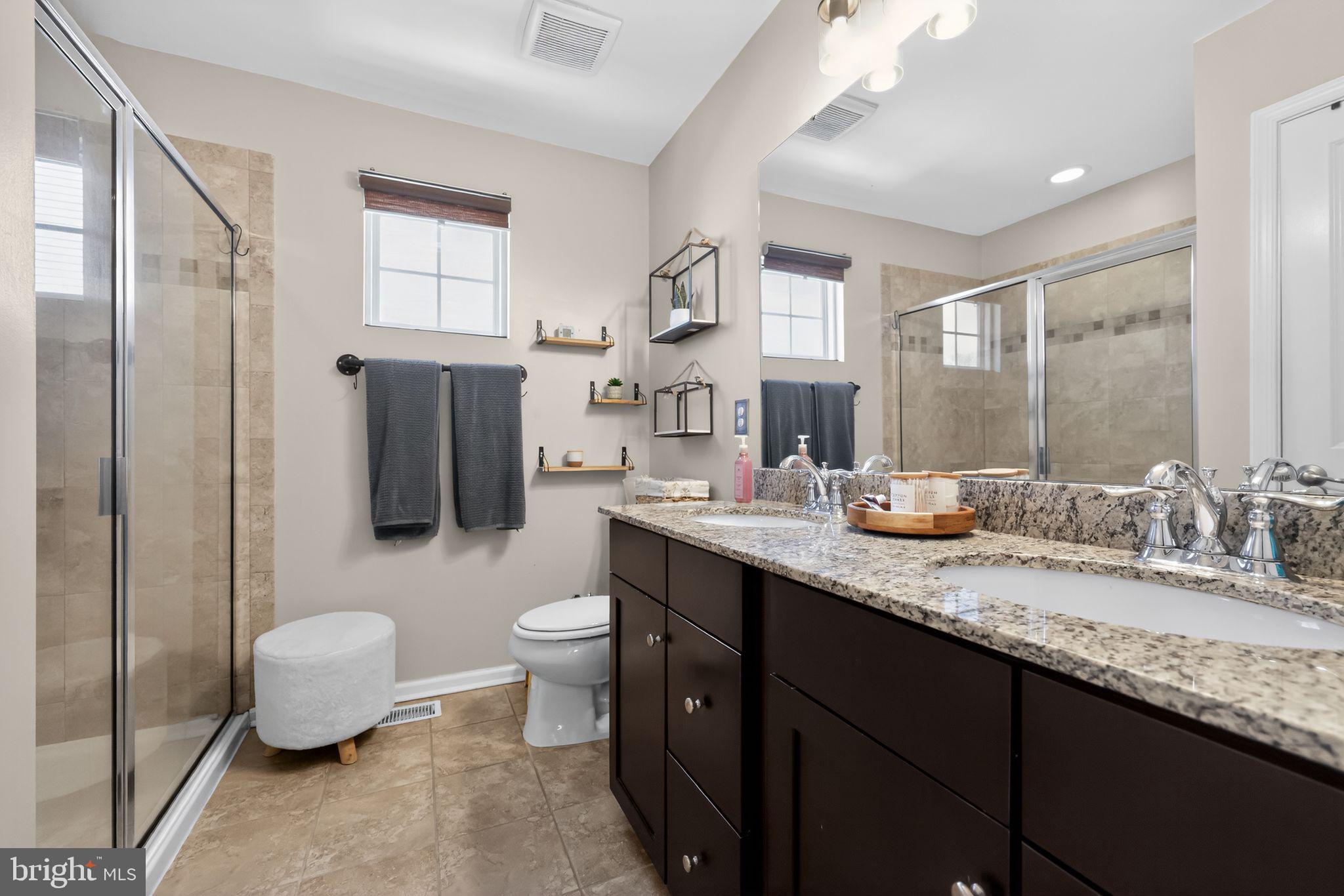 132 Redtail Hawk Circle Sewell, NJ 08080 - Photo 18 of 30 a bathroom with a granite countertop sink a toilet and a mirror