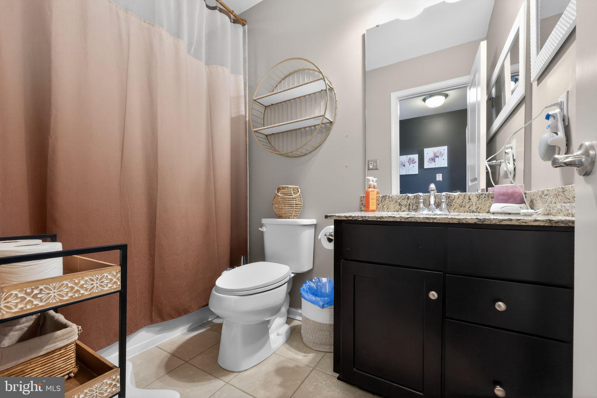 132 Redtail Hawk Circle Sewell, NJ 08080 - Photo 26 of 30 a bathroom with a sink a toilet and a mirror
