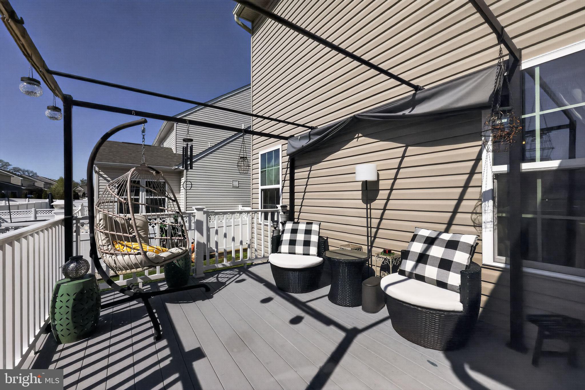 132 Redtail Hawk Circle Sewell, NJ 08080 - Photo 27 of 30 a view of a patio with couple of chairs and a potted plant