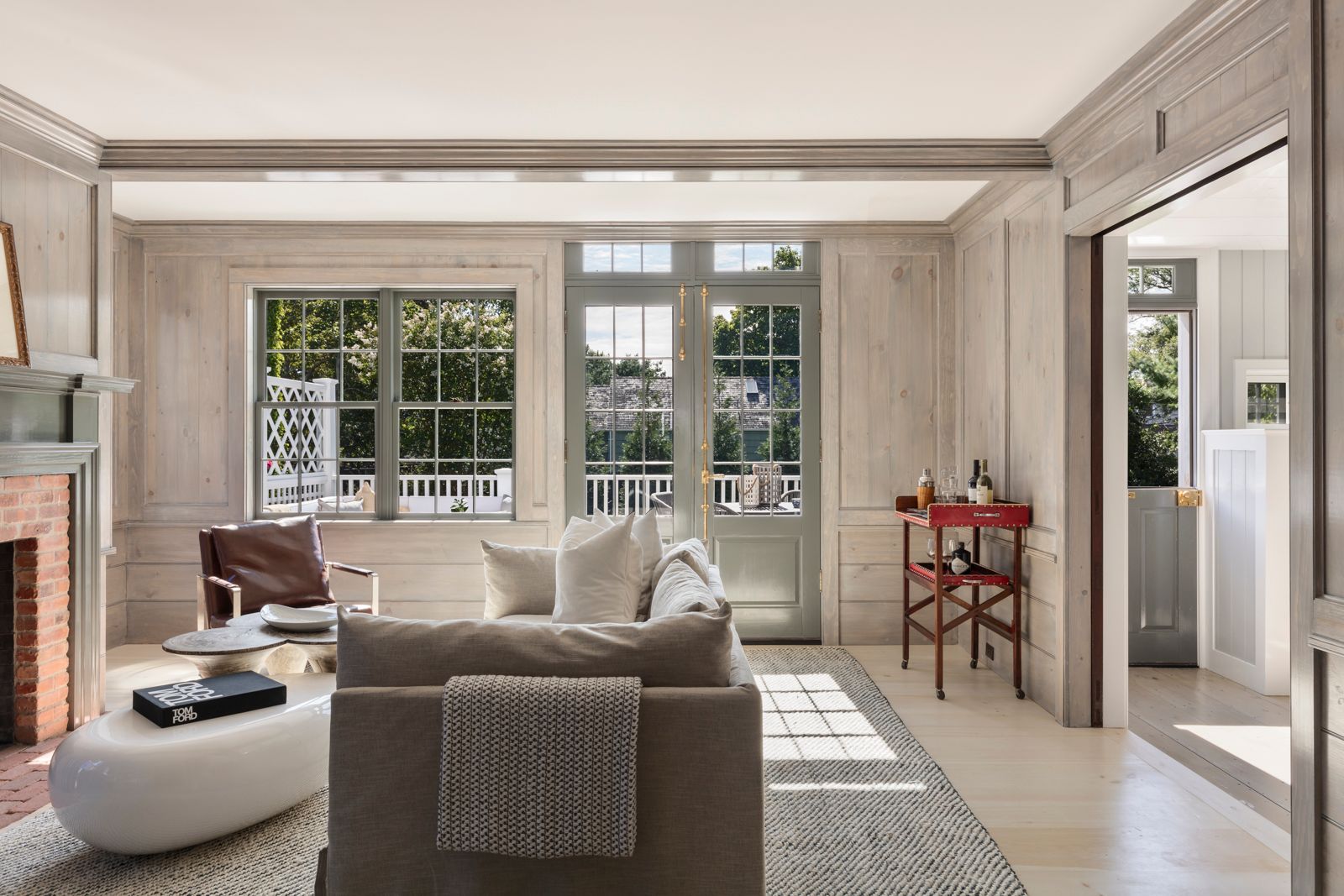 43 Howard Street Sag Harbor, NY 11963 - Photo 12 of 31 a living room with furniture and a large window