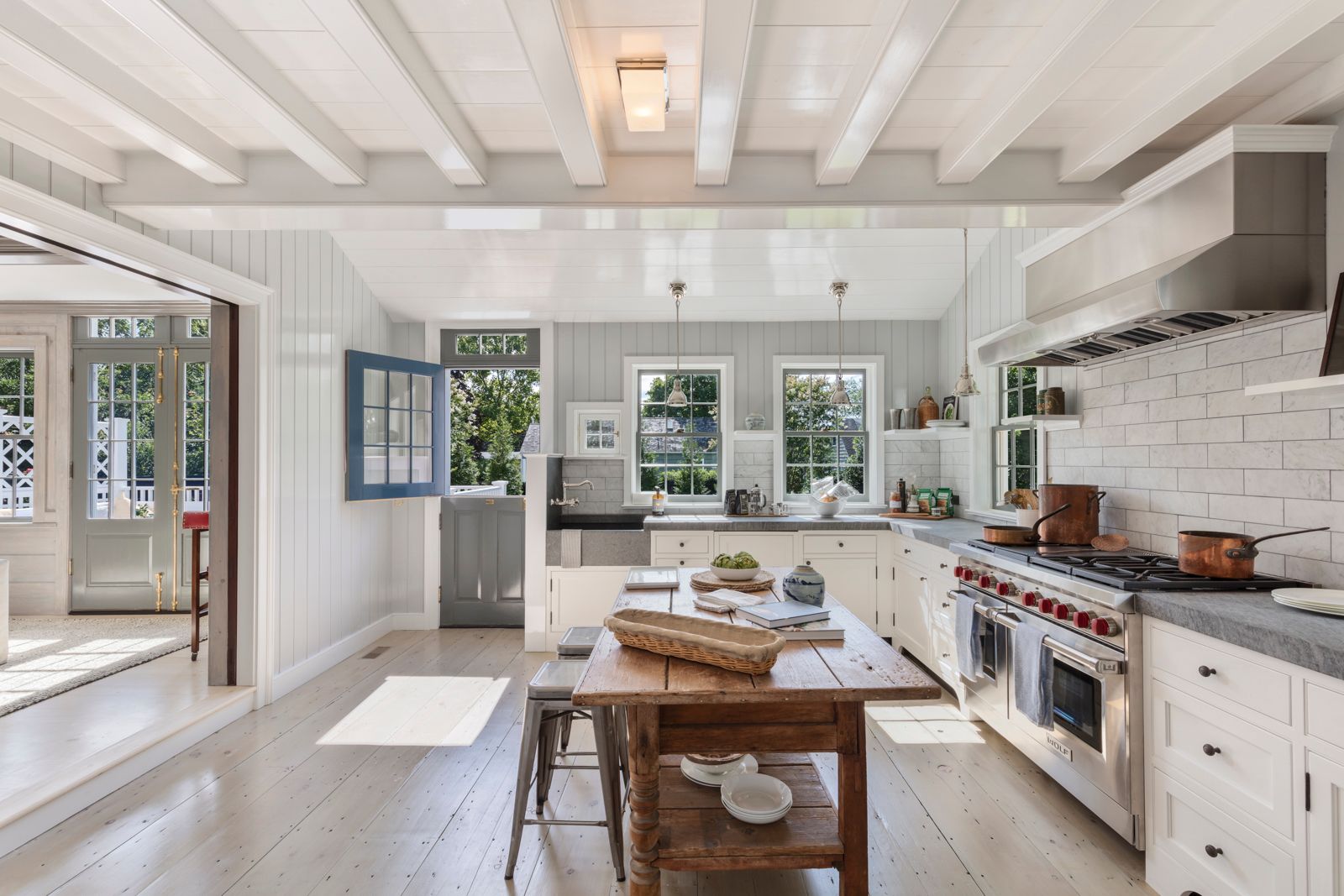 43 Howard Street Sag Harbor, NY 11963 - Photo 13 of 31 a kitchen with a stove and cabinets