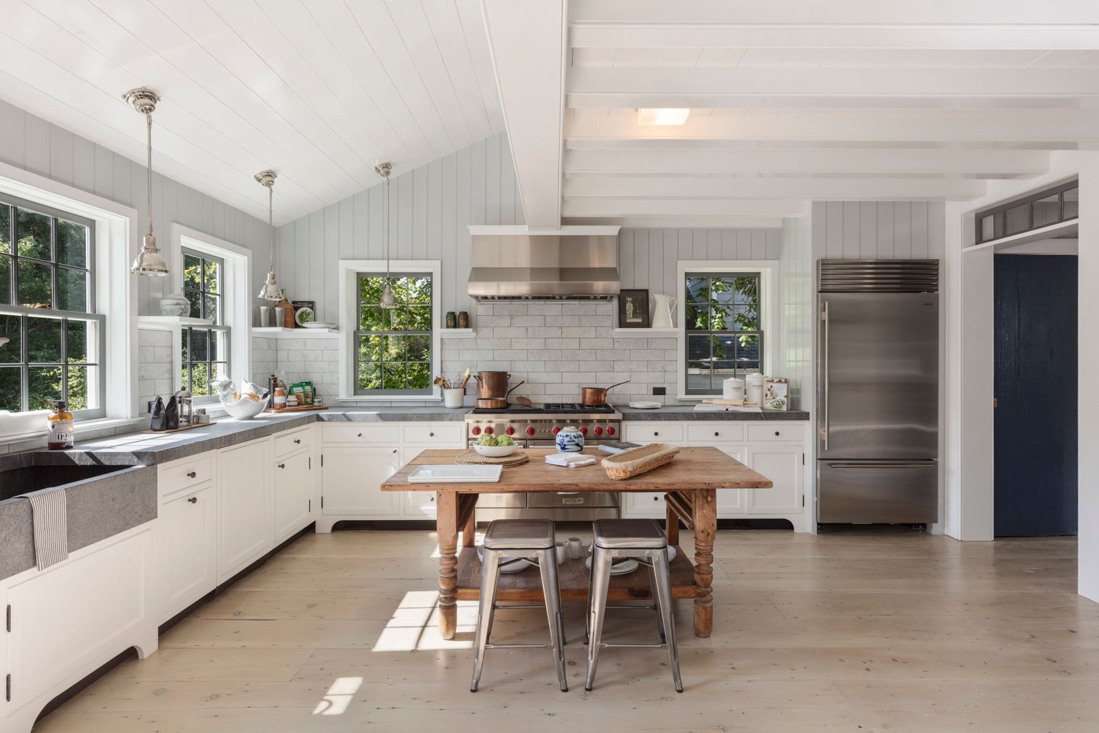 43 Howard Street Sag Harbor, NY 11963 - Photo 14 of 31 a kitchen with center island table and chairs