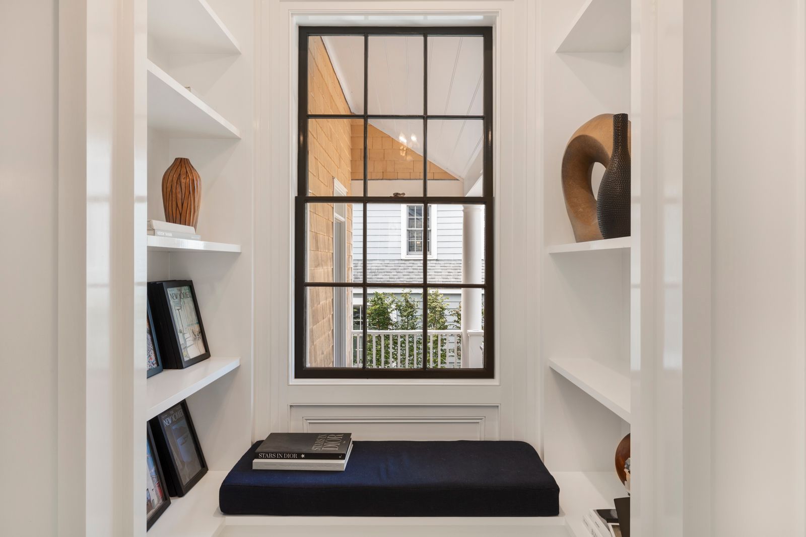 43 Howard Street Sag Harbor, NY 11963 - Photo 24 of 31 a bathroom with a sink and a window