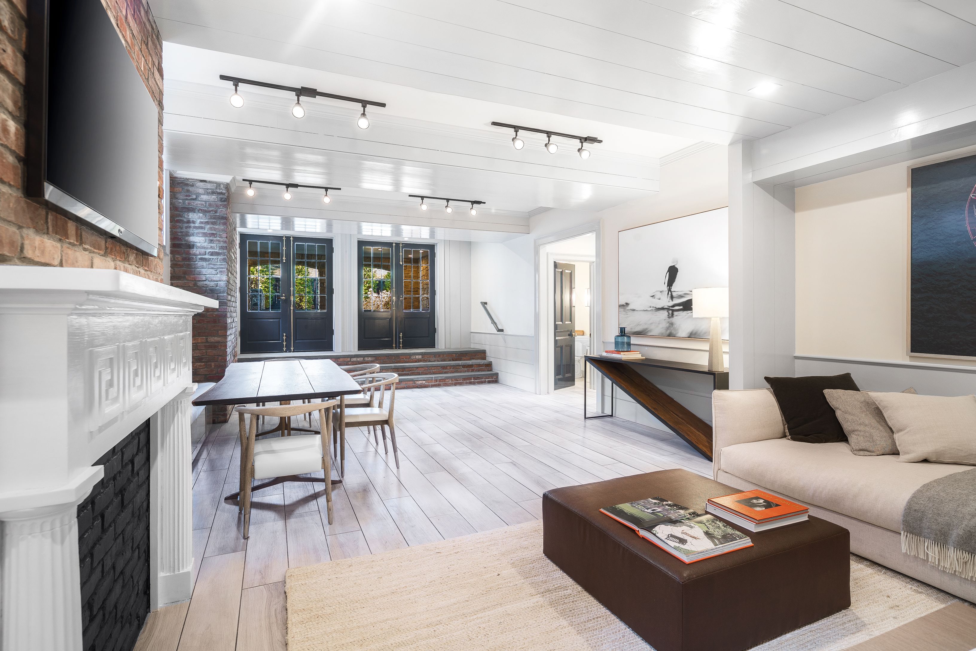 43 Howard Street Sag Harbor, NY 11963 - Photo 27 of 31 a living room with furniture and a fireplace