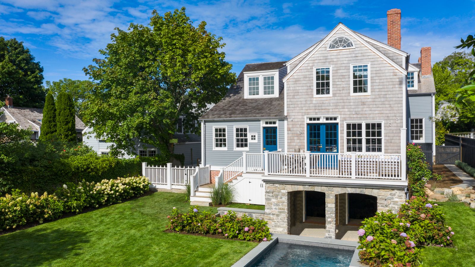43 Howard Street Sag Harbor, NY 11963 - Photo 4 of 31 a front view of a house with a yard