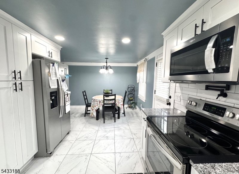 13 Highway 46 Columbia, NJ 07832 - Photo 5 of 22 a kitchen with stainless steel appliances kitchen island granite countertop a stove and a refrigerator