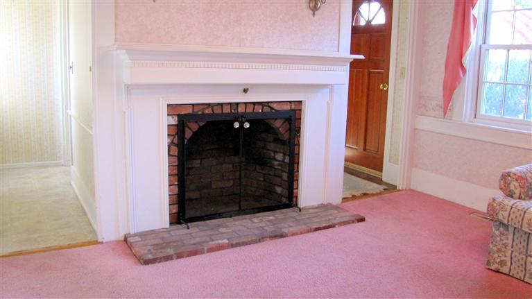 265 Chatham Road Harwich, MA 02645 - Photo 12 of 35 a view of a fireplace with an empty room