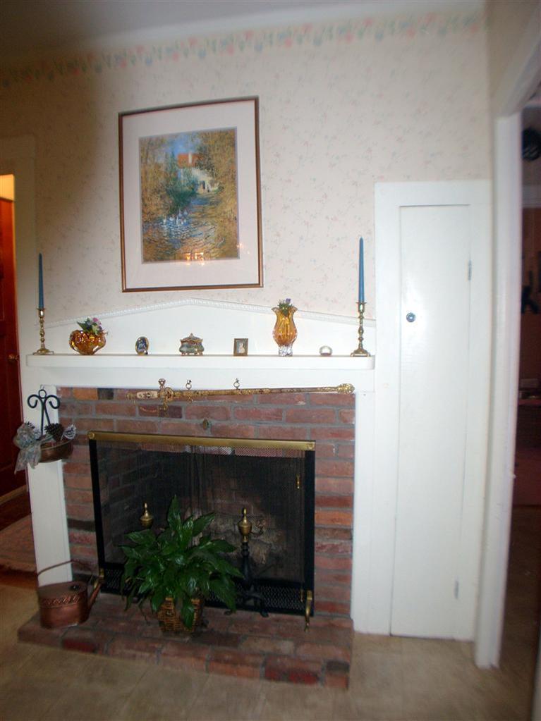 265 Chatham Road Harwich, MA 02645 - Photo 17 of 35 a living room with furniture and a fireplace