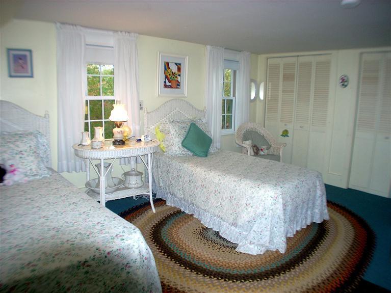 265 Chatham Road Harwich, MA 02645 - Photo 20 of 35 a bedroom with a bed and wooden floor